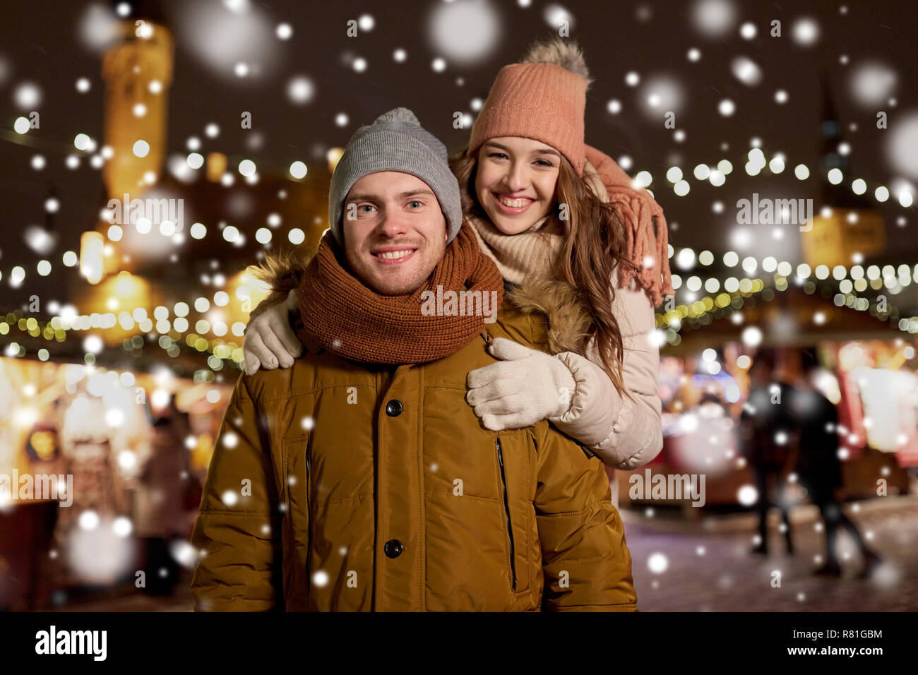 happy couple hugging at christmas market Stock Photo