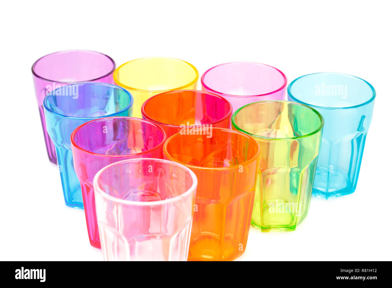 Colorful plastic glasses on white background. Stock Photo