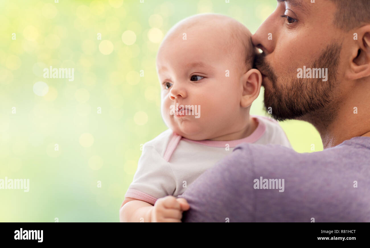 close up of father kissing little baby daughter Stock Photo - Alamy