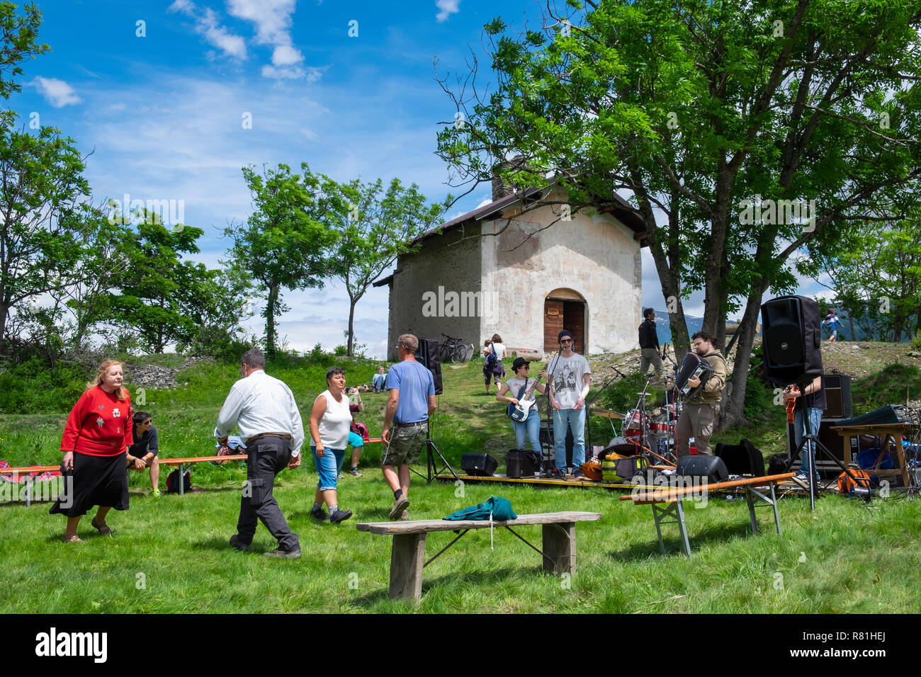 Mountain village saints day festival wth band and people dancing, Soubras, Piemonte, Italy Stock Photo