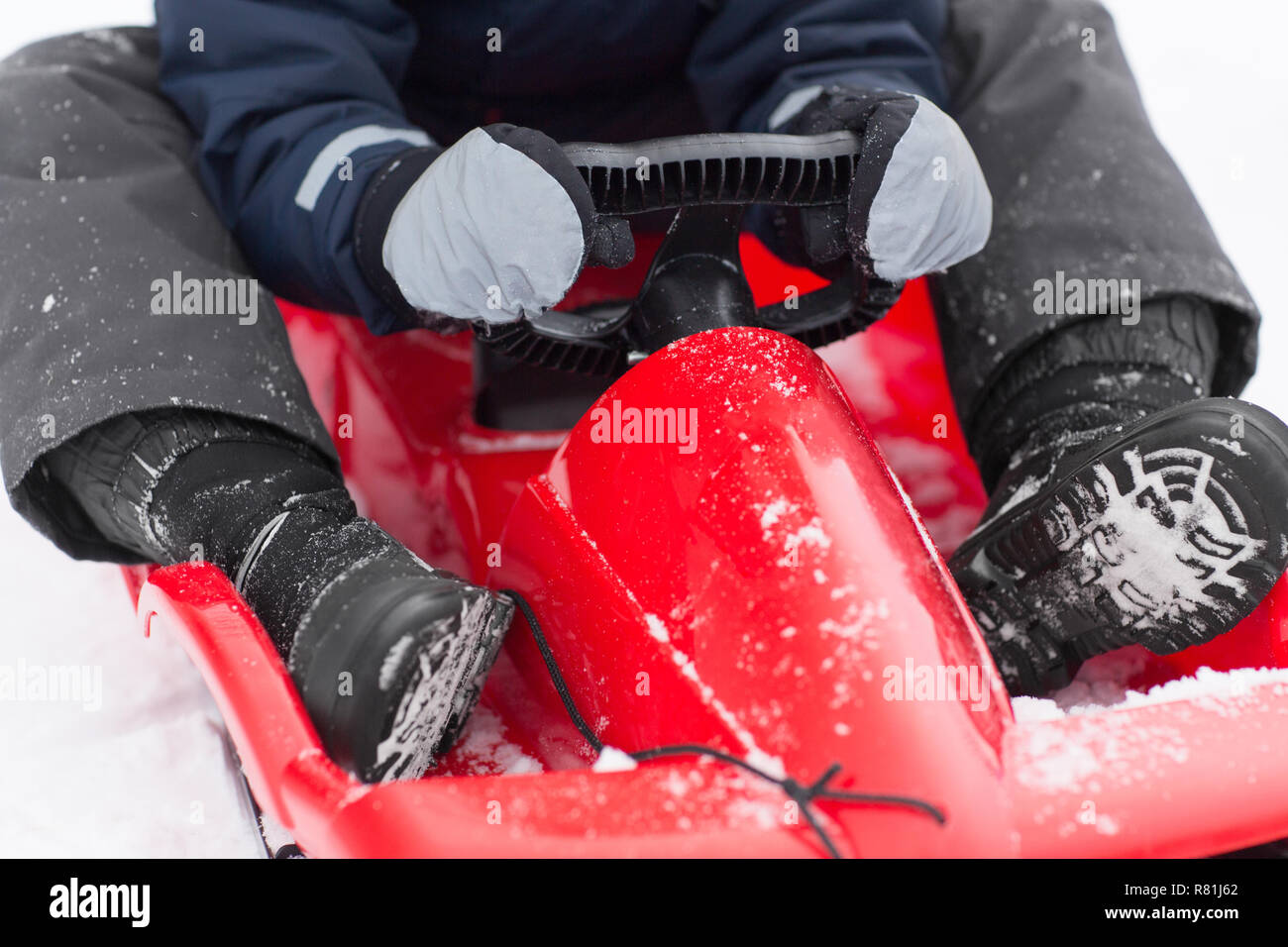 Boy riding sledge hires stock photography and images Alamy