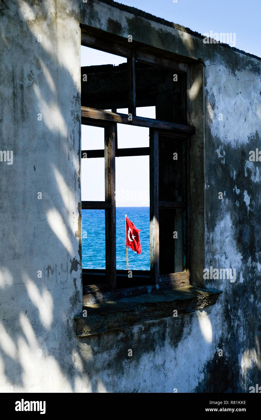 Waving Turkey flag framed on an old window Stock Photo