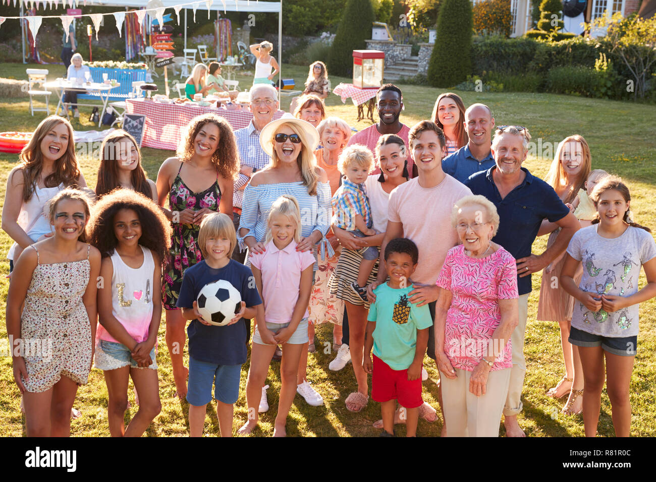 Group Portrait Of People Attending Summer Garden Fete Stock Photo