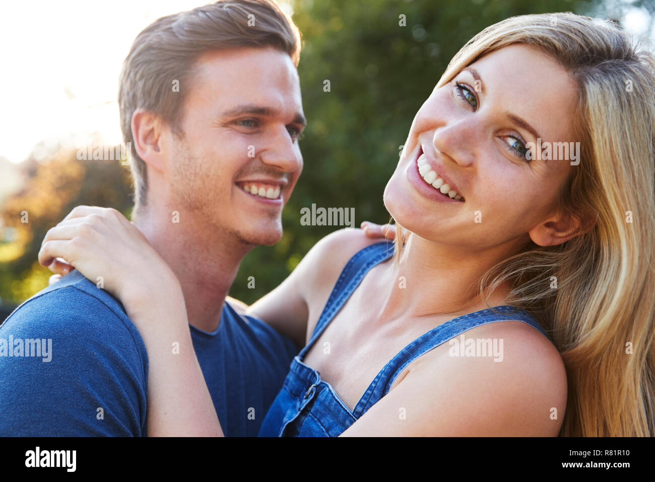 Portrait Of Smiling Couple Outdoors In Summer Park Stock Photo