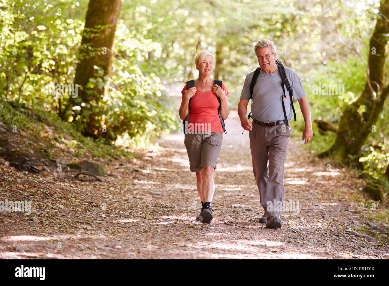 Man walking along woodland path hi-res stock photography and images - Alamy