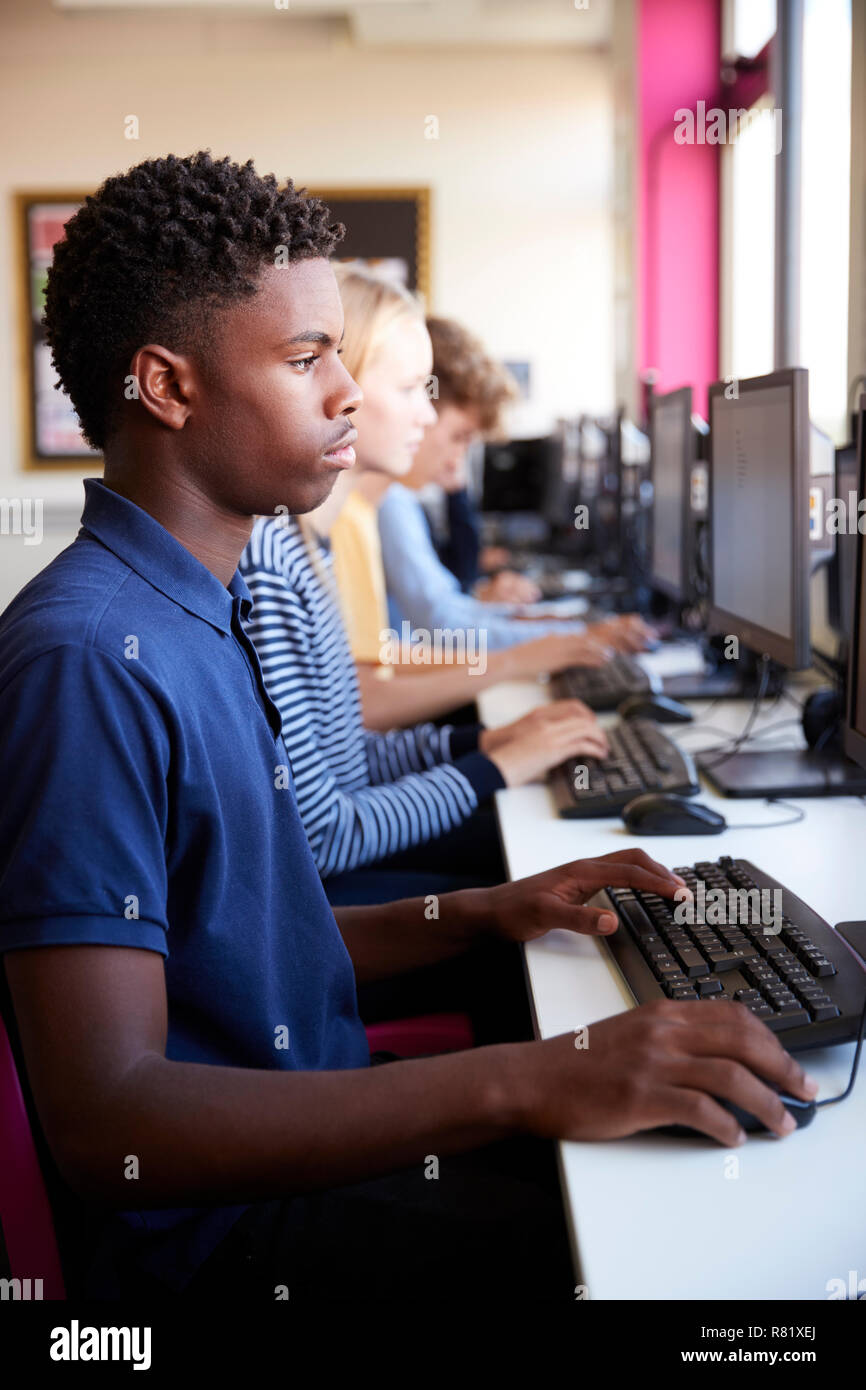 Line Of Teenage High School Students Studying In Computer Class Stock Photo