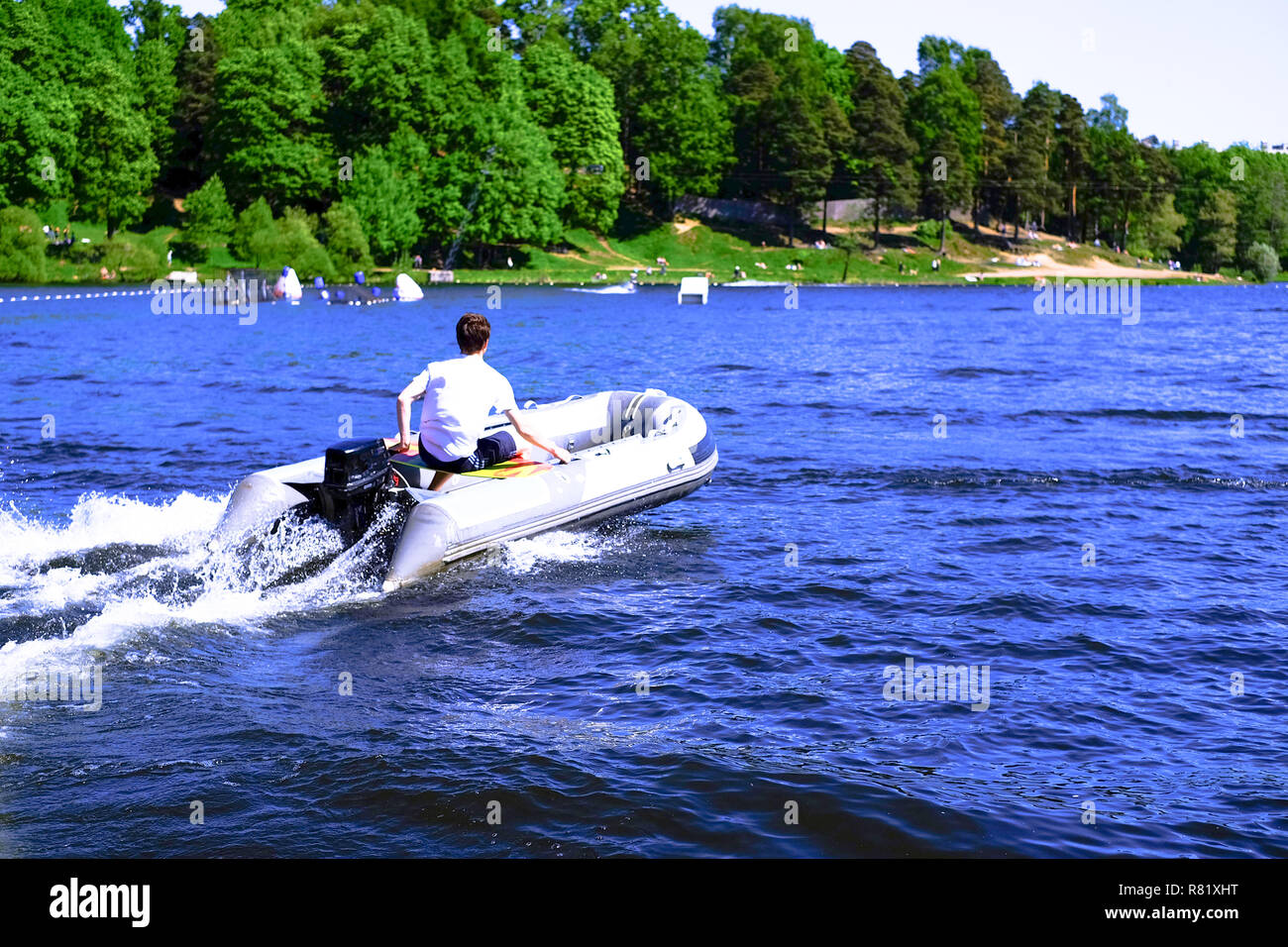 Modern Inflatable Rubber Speed Motor Boat on water. motor inflatable