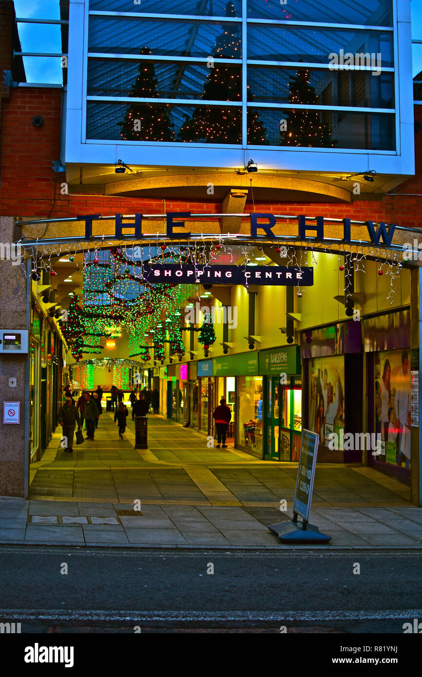 Shoppers enjoying strolling under the Christmas lights inThe Rhiw, an indoor shopping centre & market in the centre of Bridgend, South Wales. Stock Photo