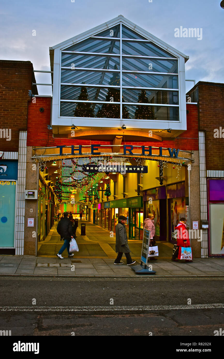 Shoppers enjoying strolling under the Christmas lights inThe Rhiw, an indoor shopping centre & market in the centre of Bridgend, South Wales. Stock Photo