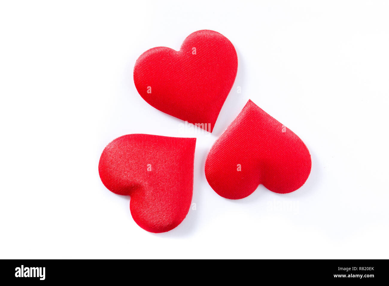 Red hearts pattern isolated on white background. Top view. Stock Photo