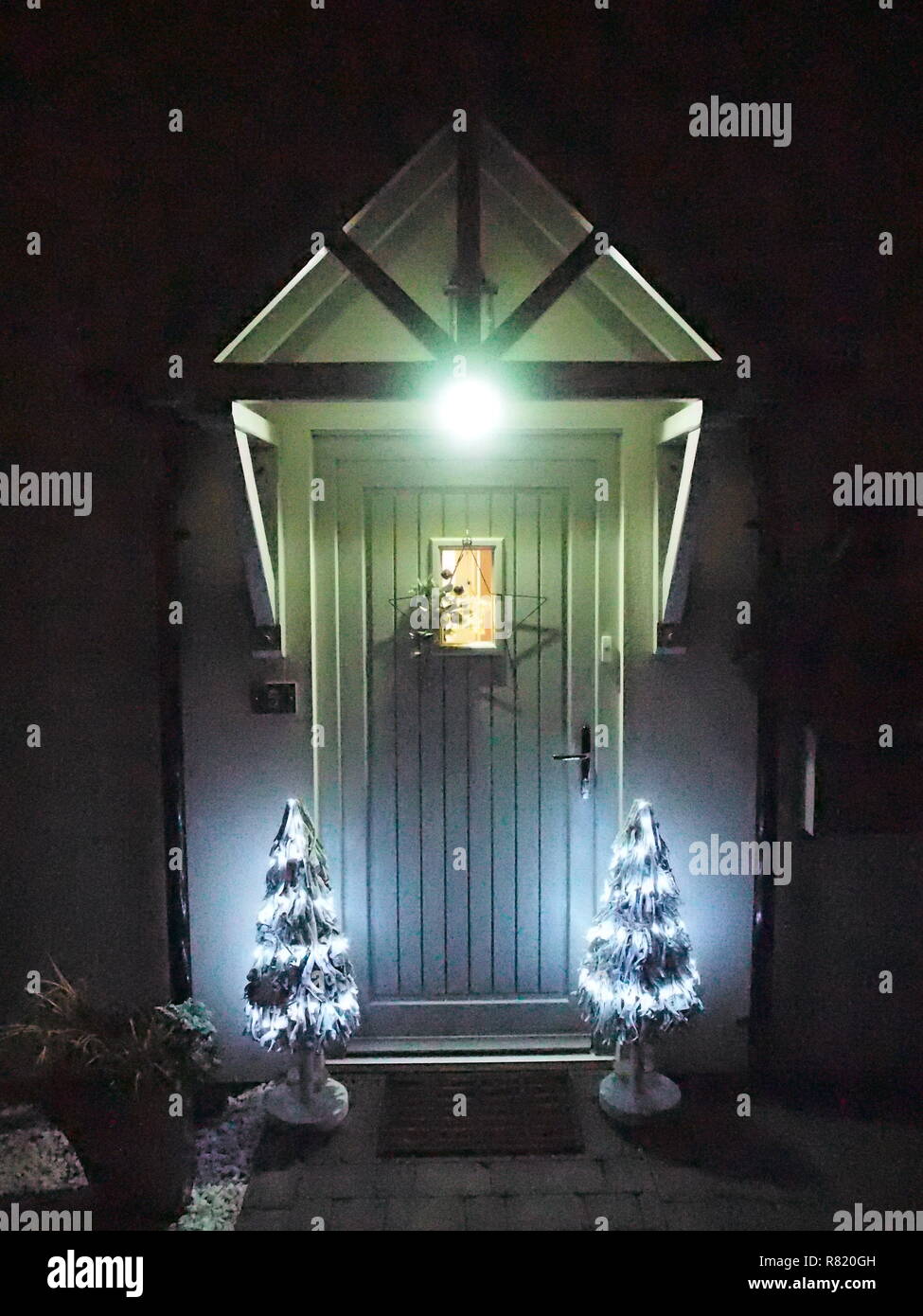 Porch And Doorway With Christmas Decoration At Night Stock Photo
