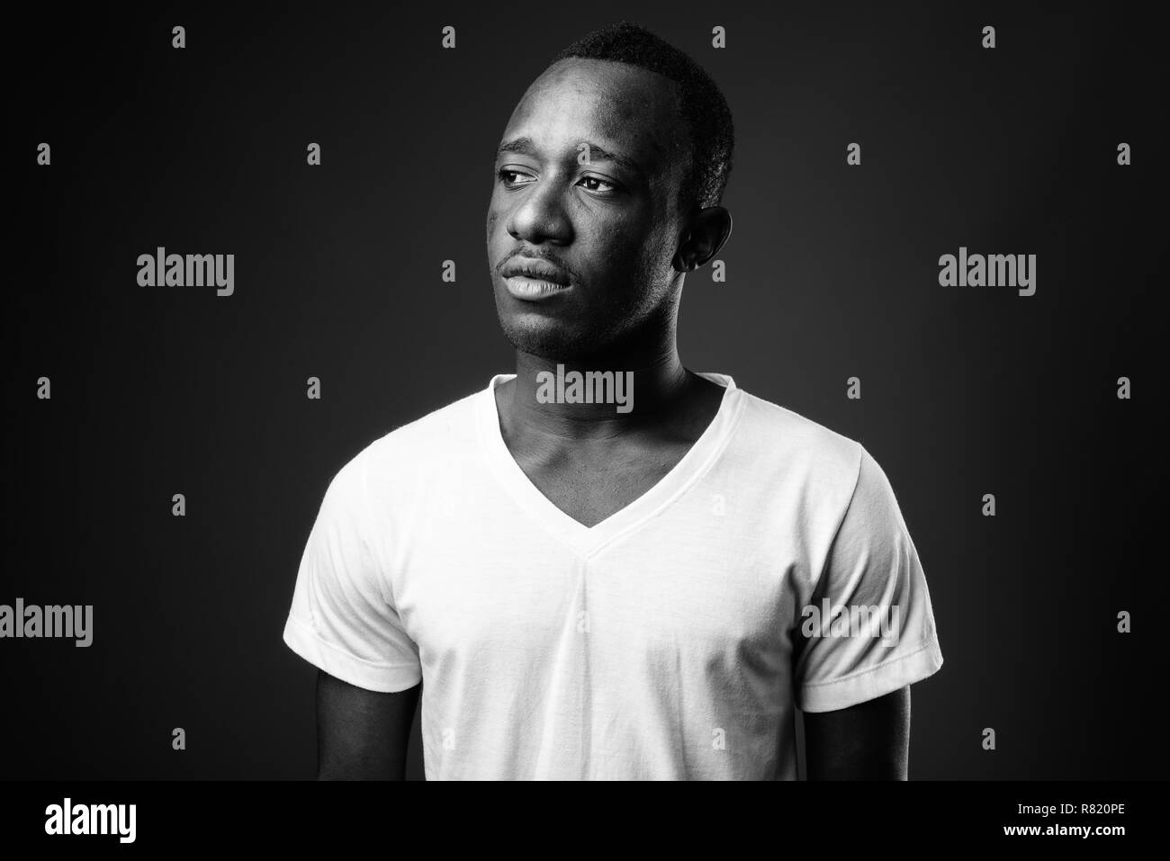 Young black man thinking hi-res stock photography and images - Alamy