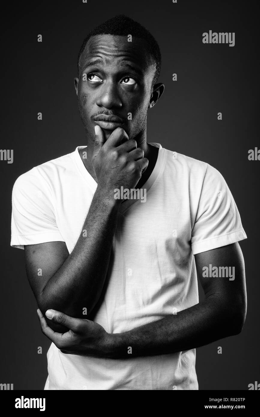 Young African man against thinking in black and white Stock Photo