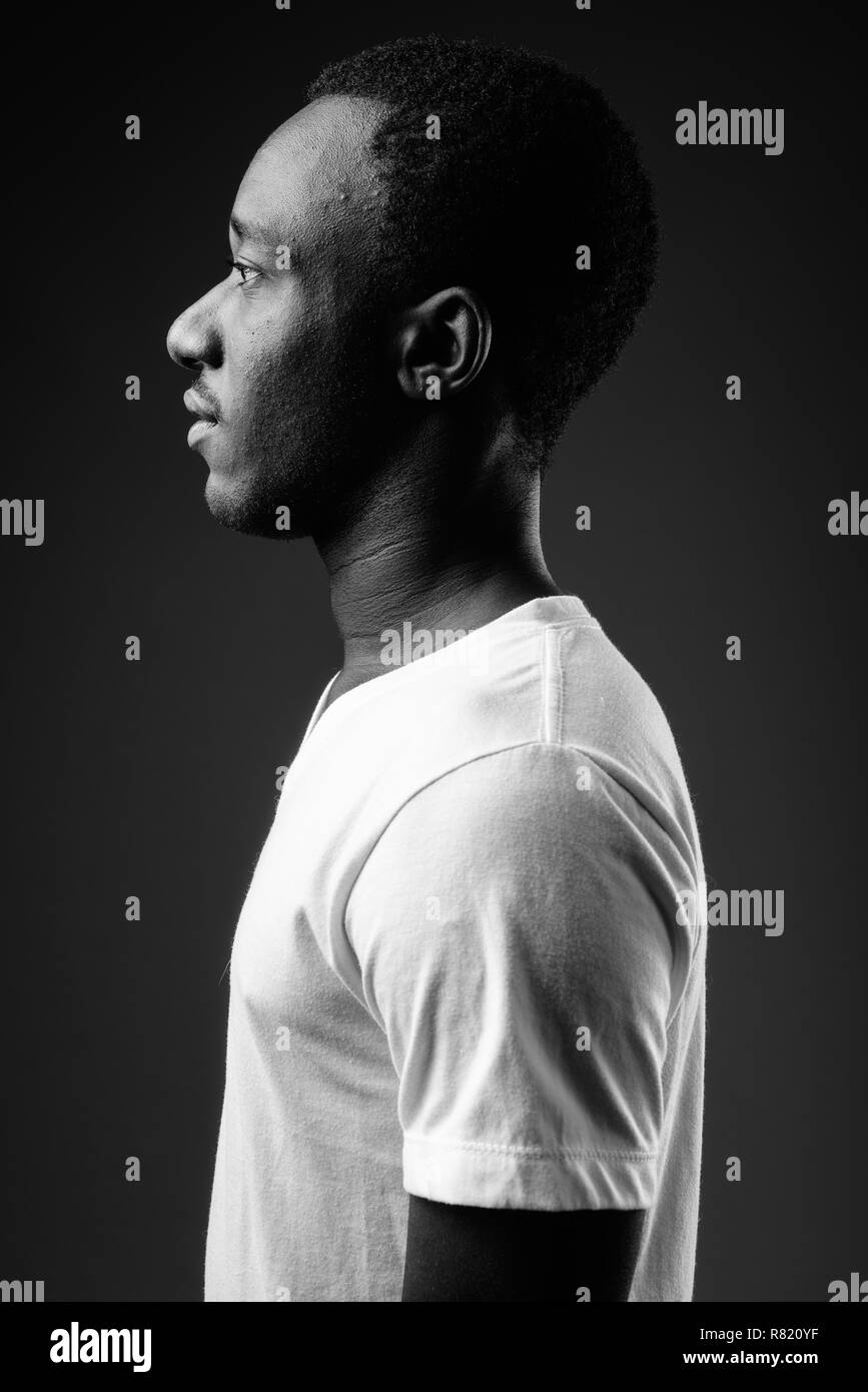 Profile view portrait of young African man in black and white Stock Photo