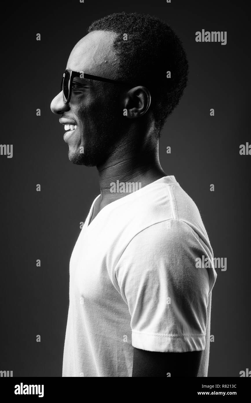 Profile view portrait of young African man smiling Stock Photo