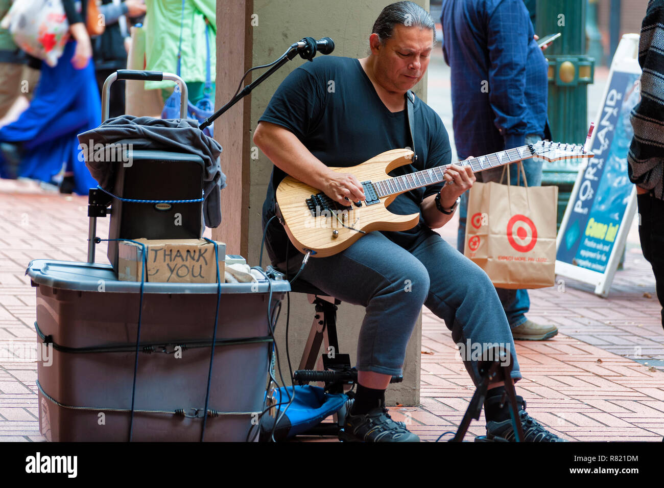 Portland, Oregon,USA - October 8, 2016: A street performer plays an electric guitar in downtown Portland, Oregon Stock Photo
