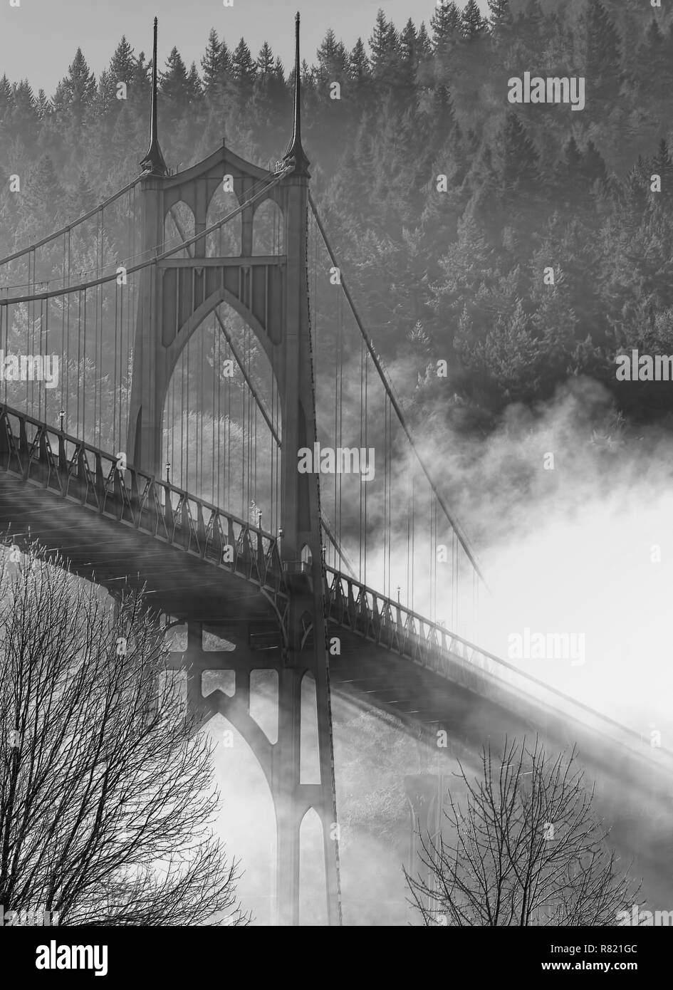 Black and white of the Gothic Style St. John's Bridge in Portland Oregon, spans the Willamette River. Construction began in 1929. Stock Photo