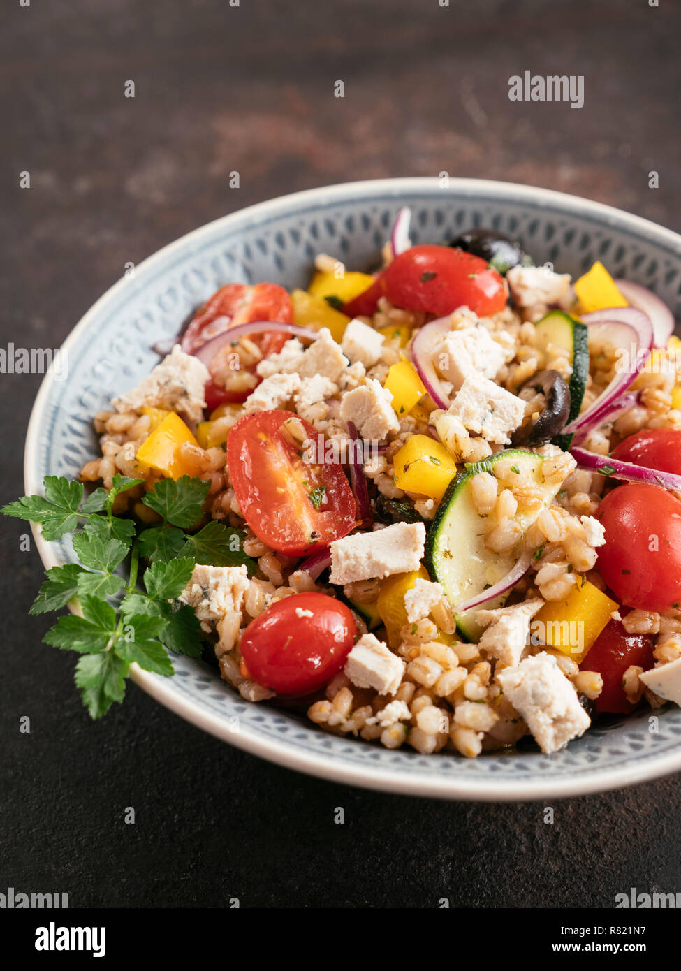 Greek Barley Salad with home made Vegan Feta. Stock Photo