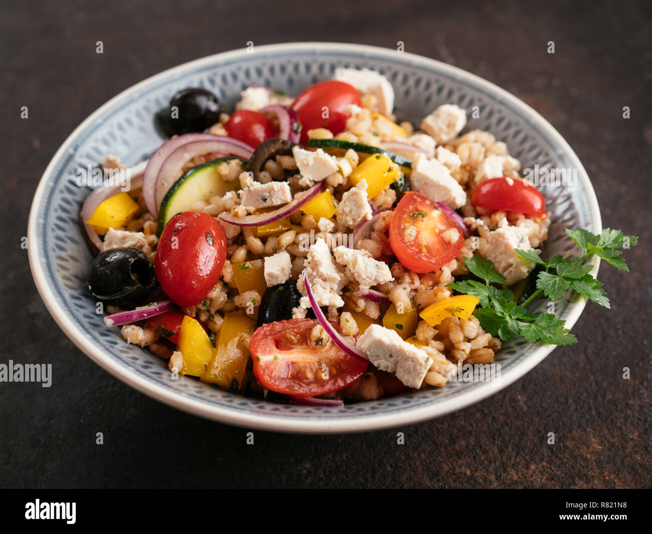 Greek Barley Salad with home made Vegan Feta. Stock Photo