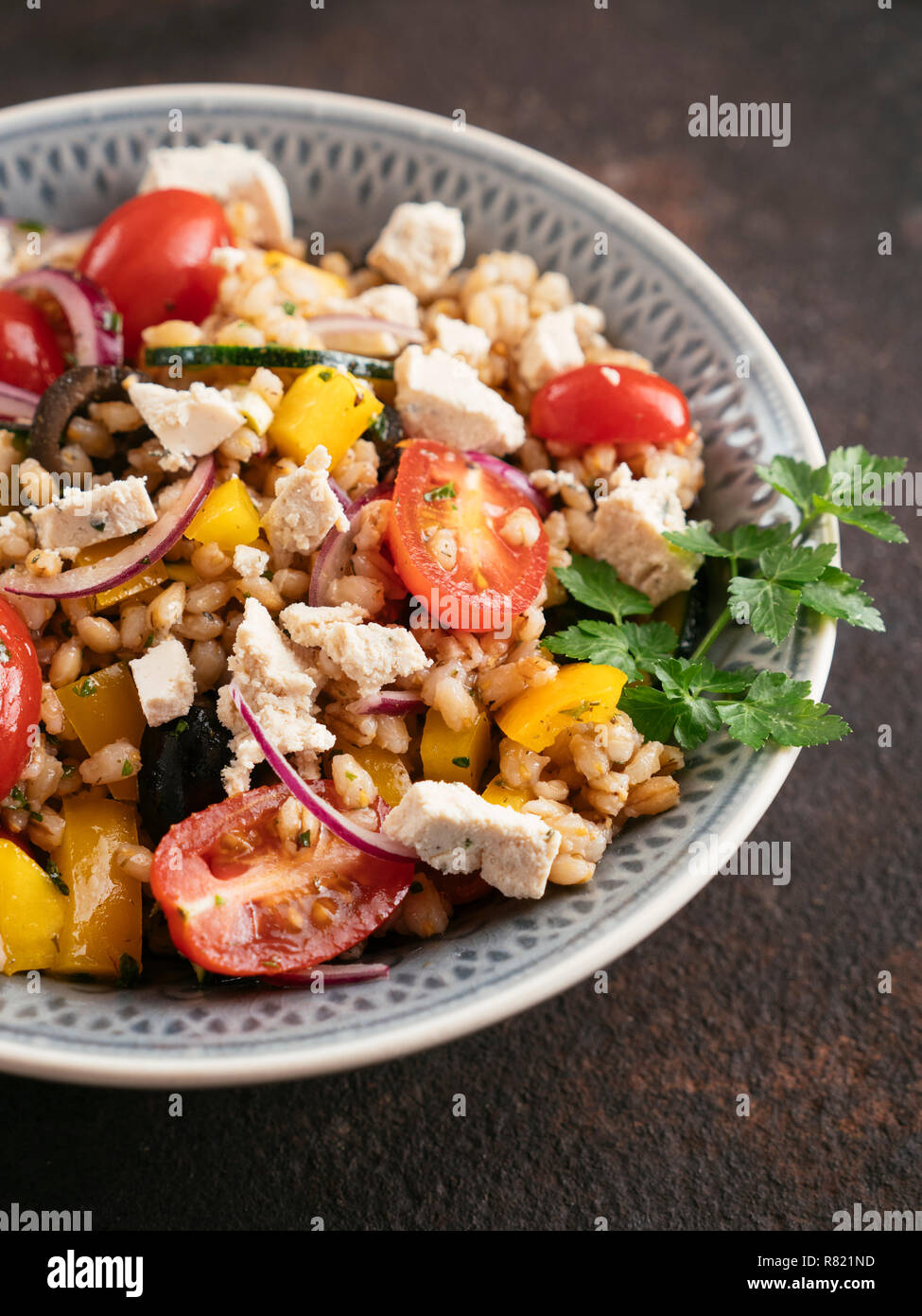 Greek Barley Salad with home made Vegan Feta. Stock Photo
