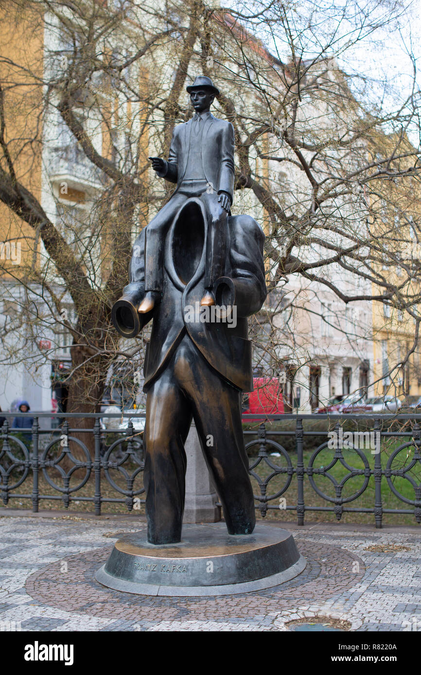 Kafka monument in the city centre. Prague. Little man on shoulders of a headless man. .The statue in bro0nzo by Franz Kafka in the Jewish quarter Stock Photo