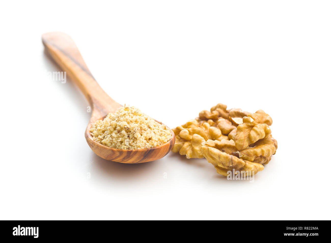 Milled and whole walnuts kernels isolated on white background. Stock Photo