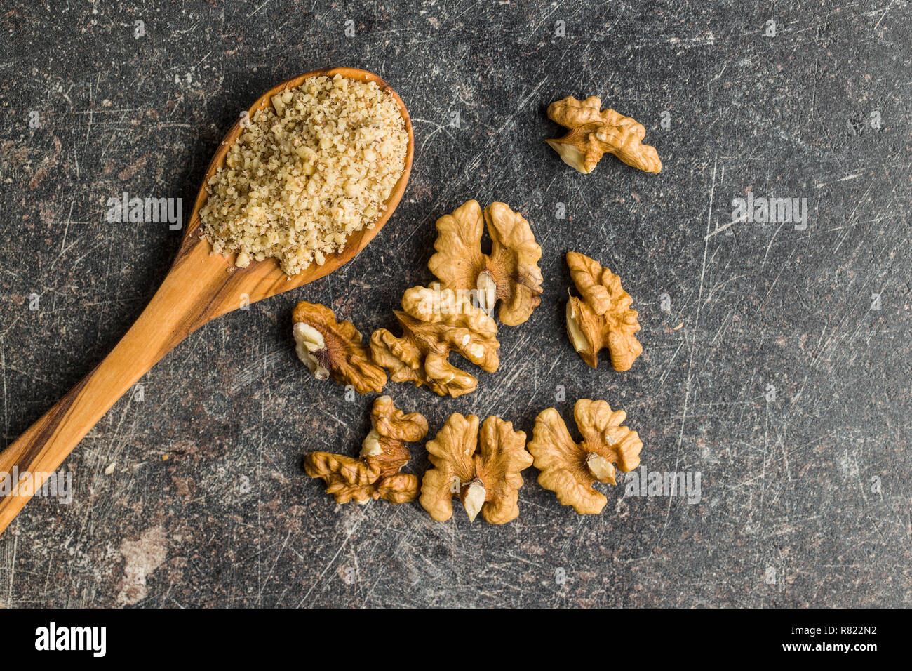 Milled and whole walnuts kernels. Stock Photo