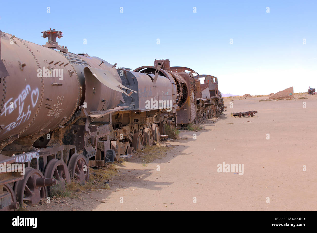 Train Cemetery, in Uyuni, Bolivia near the salt flats. Rusty old steam train. Stock Photo