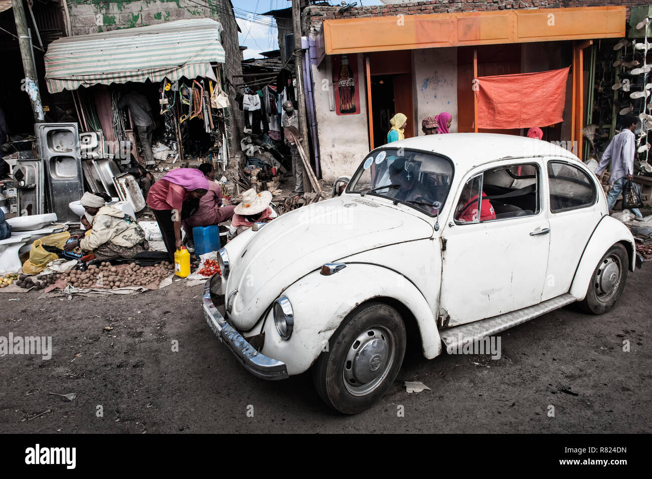 Old Volkswagen Beetle car, market street scene, Mercato of Addis Ababa, Addis Ababa, Oromia Region, Ethiopia Stock Photo
