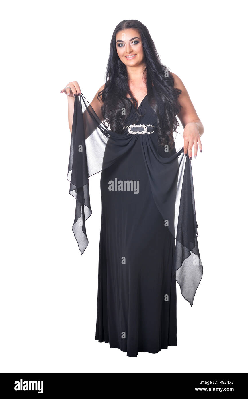 Portrait of beautiful woman in black dress posing against white Stock ...