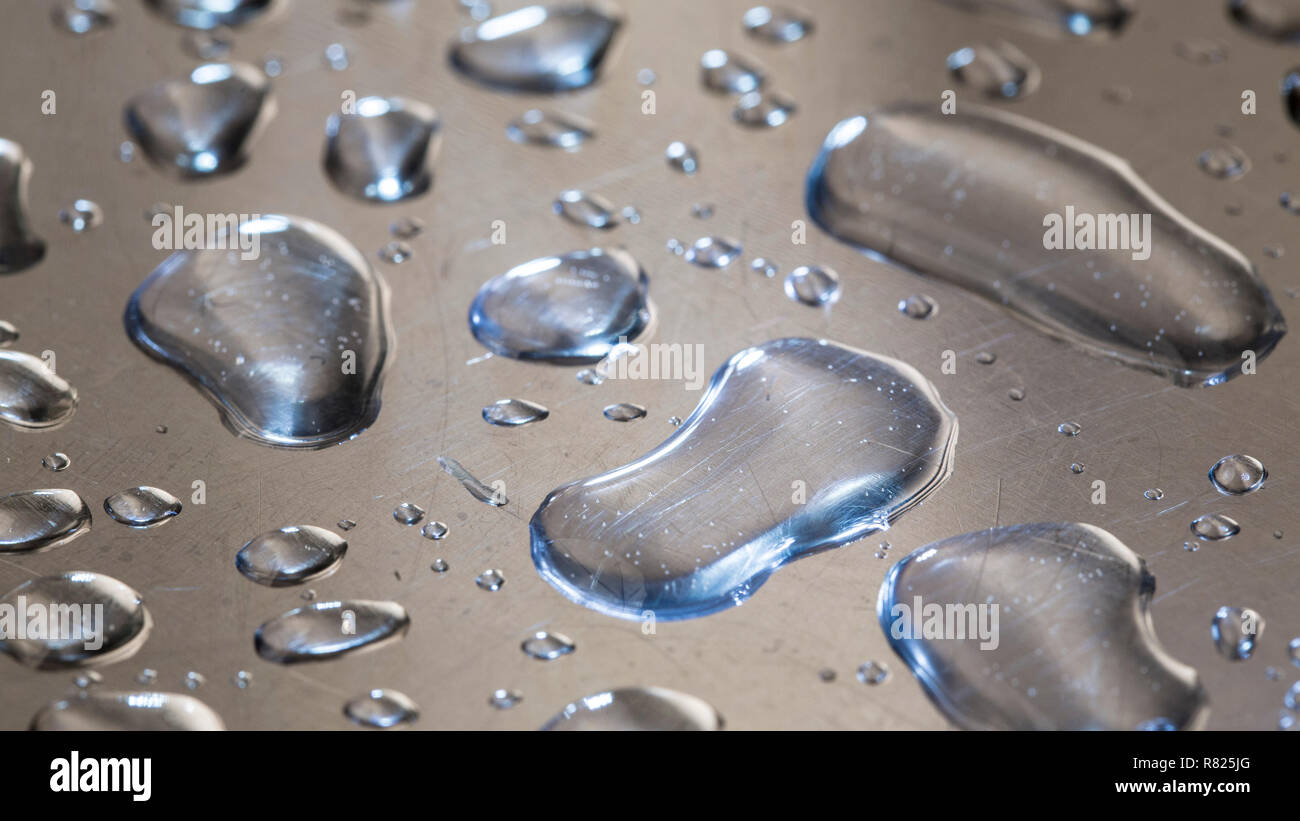 Water droplets on a metal surface Stock Photo