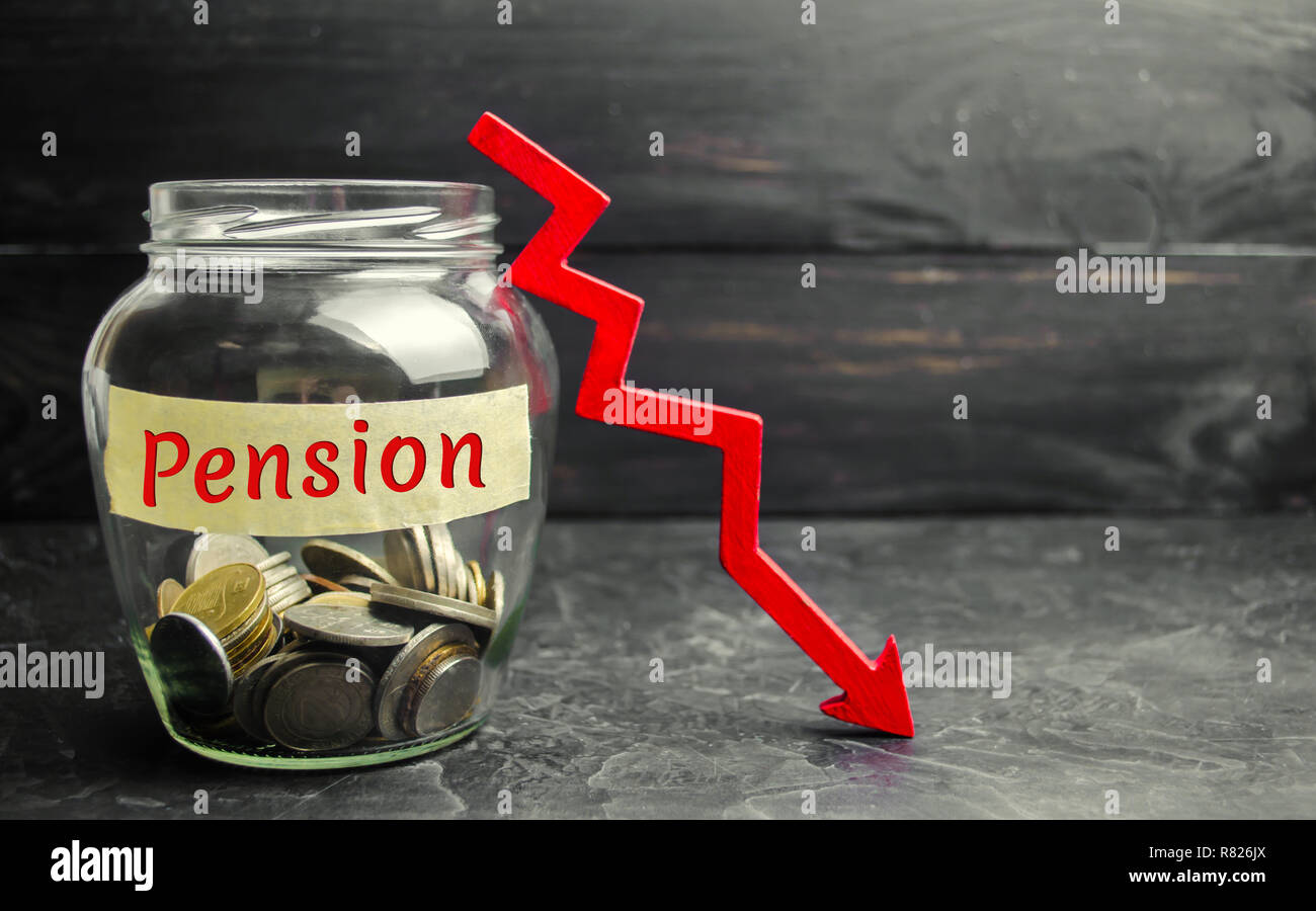 Glass jar with coins and the inscription 'Pension' and and down arrow. Decline / reduction pension payments. Retirement. Financing retirees Stock Photo