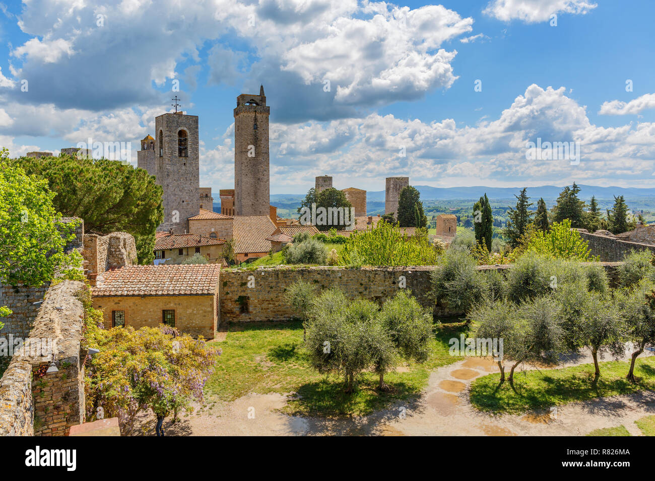 Cityscape of San Gimignano with the Courtyard of the ancient fortress ruin in Italy Stock Photo