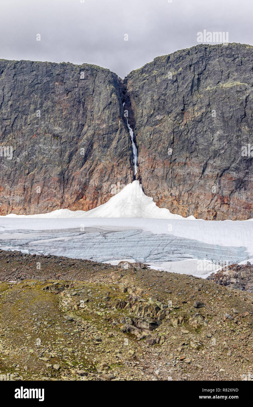Glacier at a rock face Stock Photo