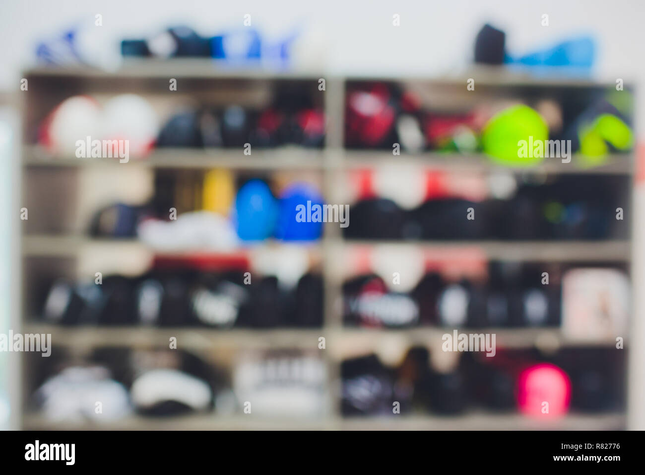 Boxing gloves, helmets and shoes for martial arts in a sports shop