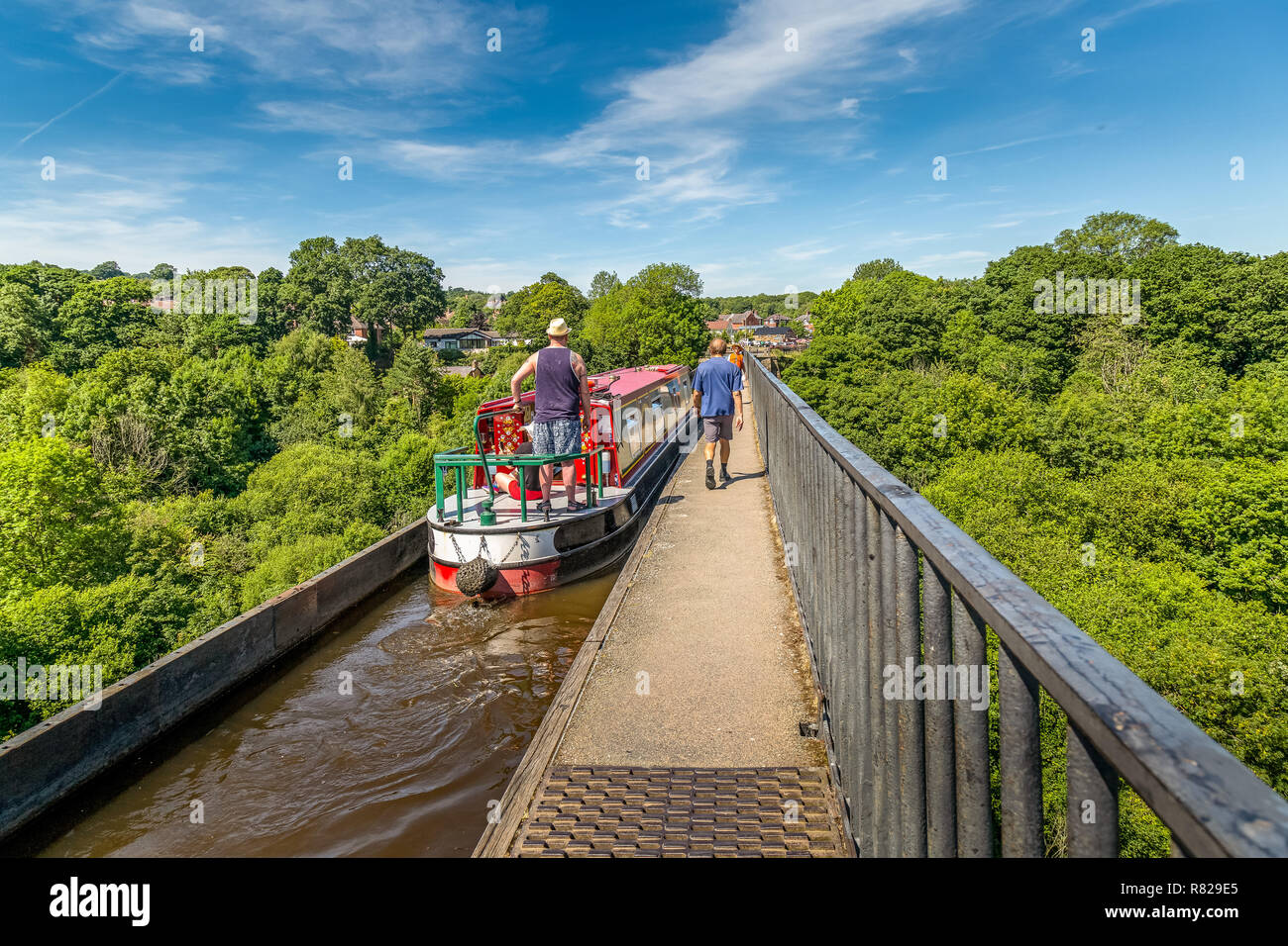 A barge, or Narrow Boat, crossing the Pontcysyllte Aqueduct near Llangollen in Wales.It carried the Llangollen canal across the River Dee. Stock Photo
