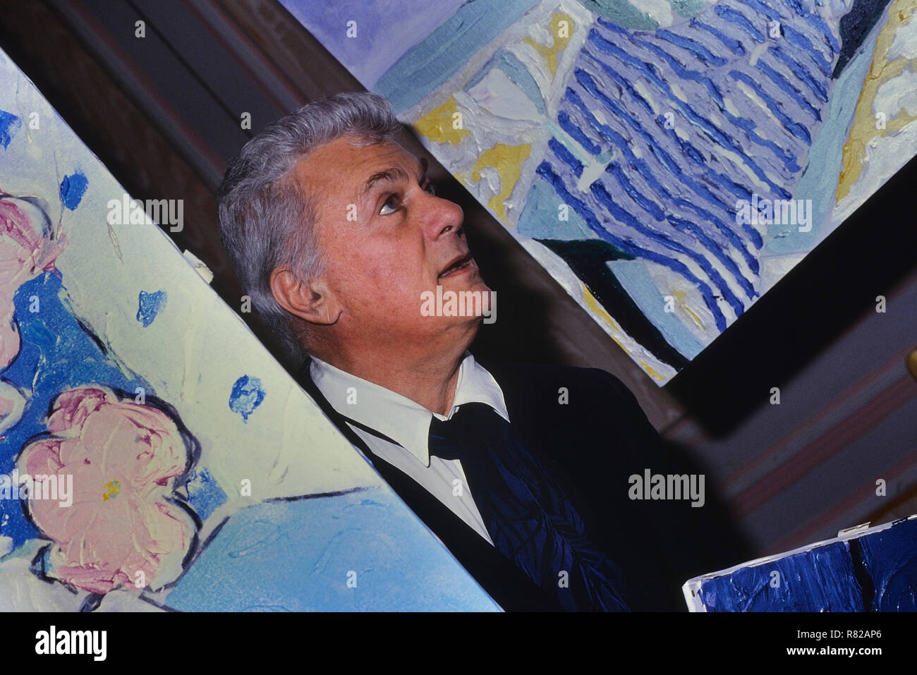 Tony Curtis actor showing a selection of his paintings in London 1989 Stock Photo