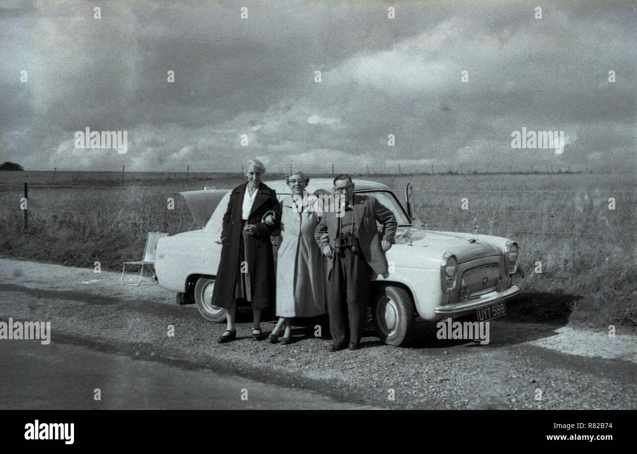 1950s, historical, a gentleman and two ladies standing outside an ...