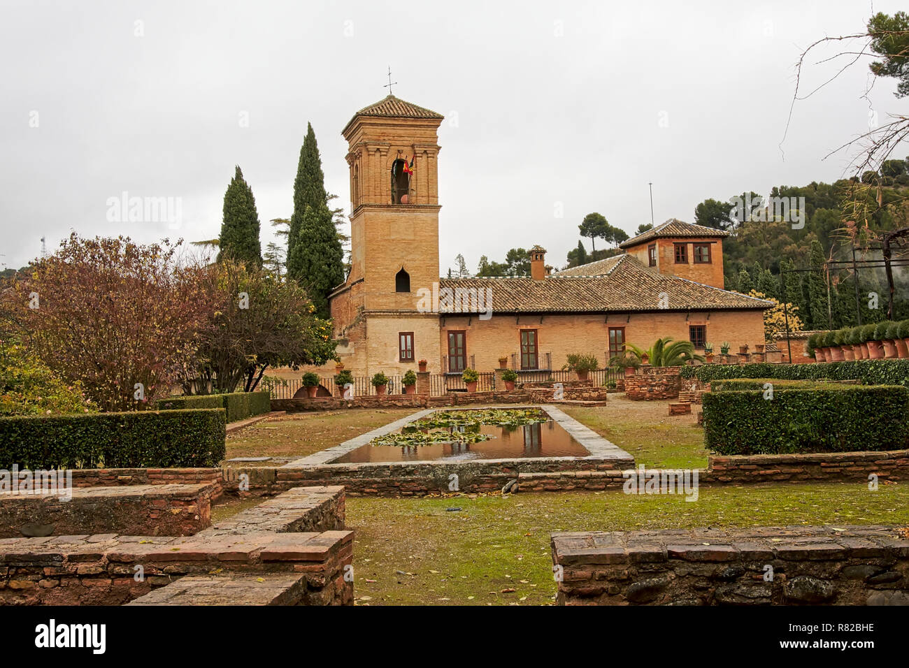 Jardins del Paraiso garden with church of Santa Maria de Alhambra ...