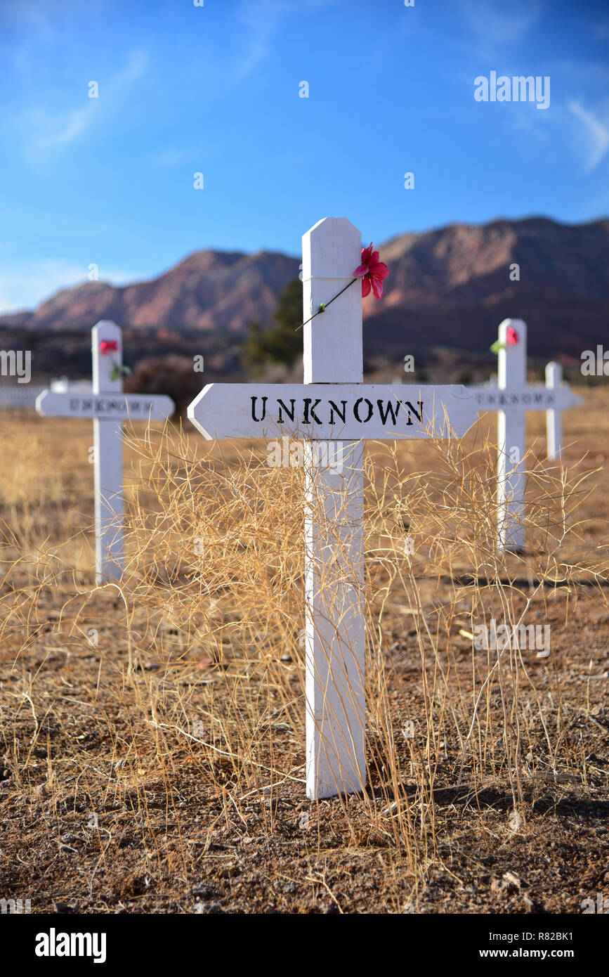 White, crosses of unknown miners and prospectors in a graveyard Stock