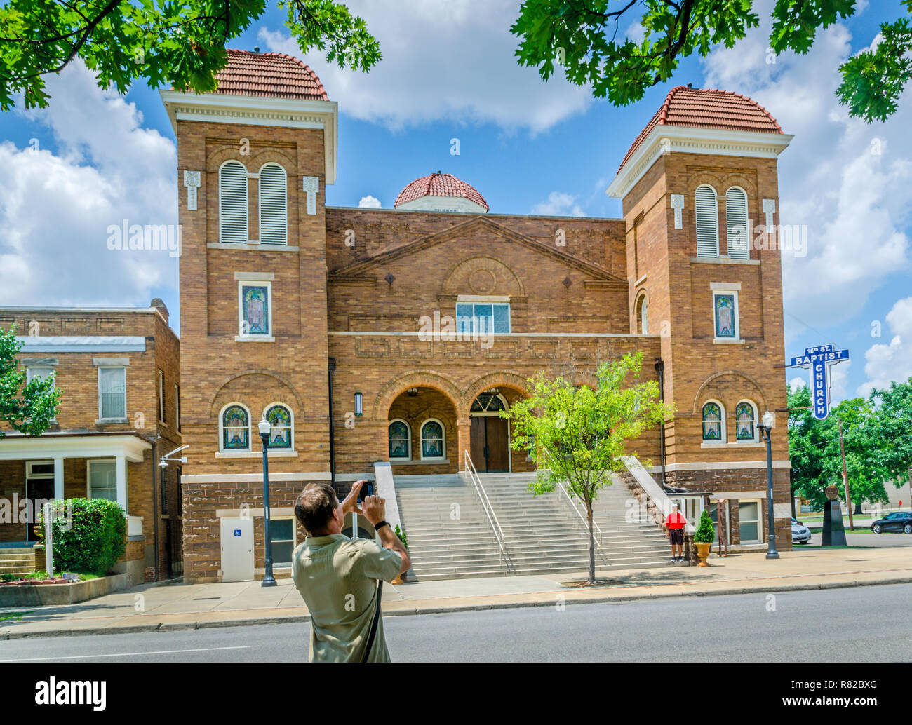 A tourist takes a photograph of 16th St. Baptist Church, July 12, 2015, in Birmingham, Alabama. Stock Photo