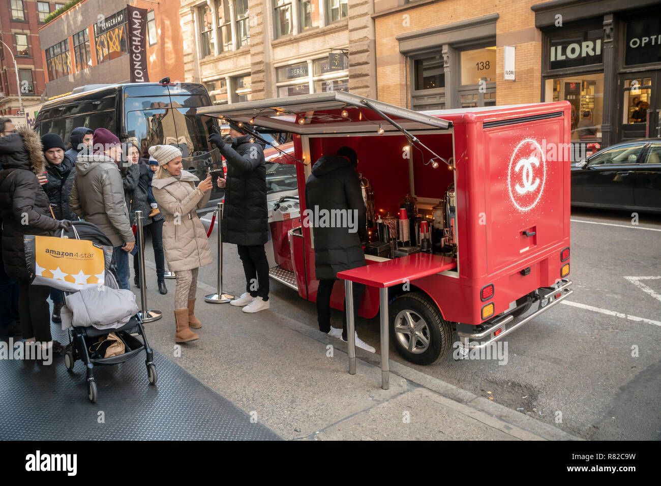 Chanel distributes free hot 'Coco' to shoppers outside their store in Soho in New York on Saturday, December 8, 2018 during the Christmas shopping season. (Â© Richard B. Levine) Stock Photo