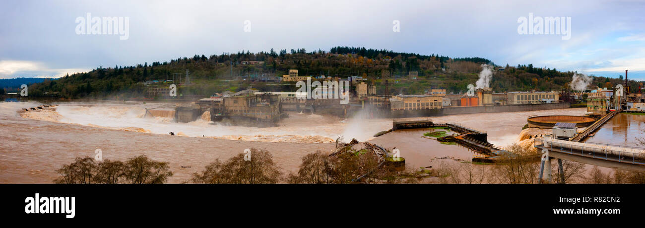 Panoramic view from above Oregon City of the Willamette River nears flood stage.  The ruins of an old power plant and paper mill that have greatly alt Stock Photo