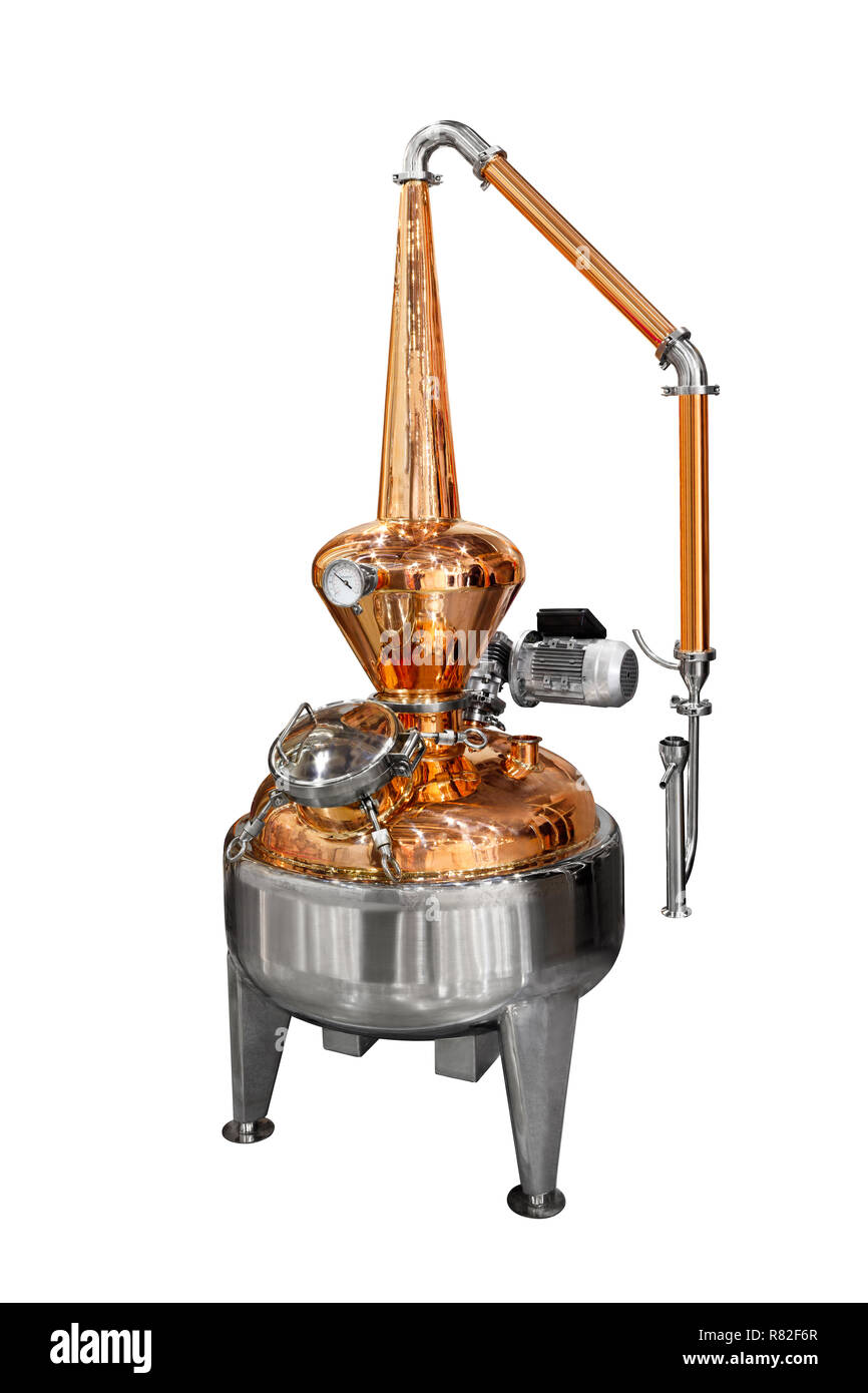 Traditional distiller tank made from copper production of alcohol, cognac, whiskey. Copper modern distiller for alcohol production isolated on a white Stock Photo