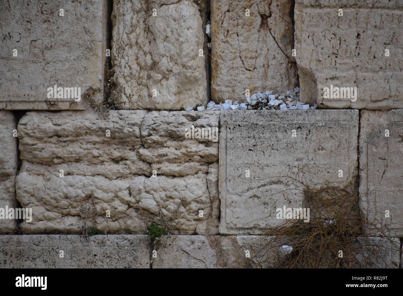 Piles of Folded Notes with Prayers in the Western Wall, Jerusalem Stock Photo