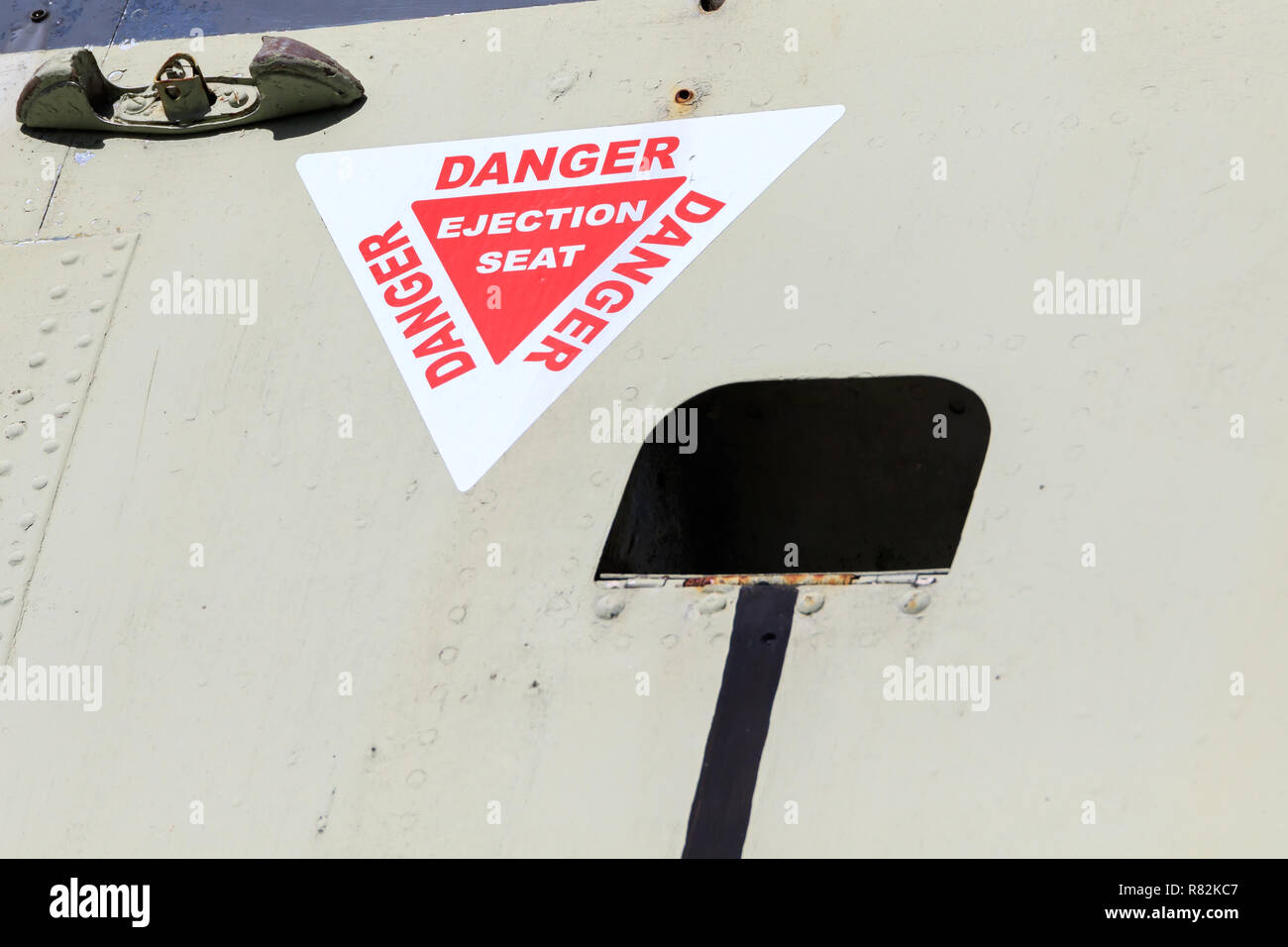 Danger Ejection Seat sign on an old jet plane Stock Photo
