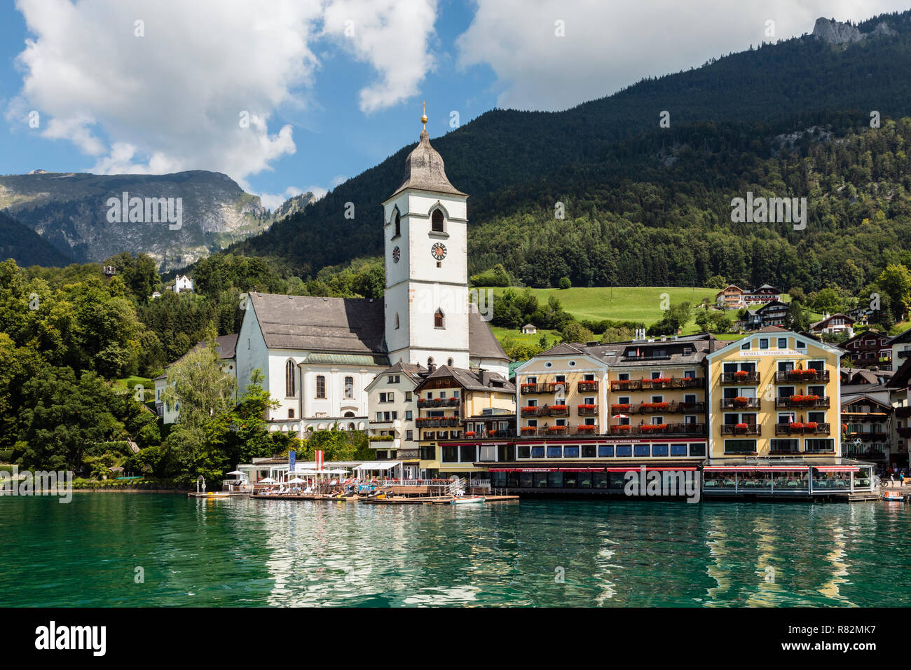Church of St Wolfgang and the White Horse Inn from the lake, St Wolfgang im Salzkammergut, Austria Stock Photo