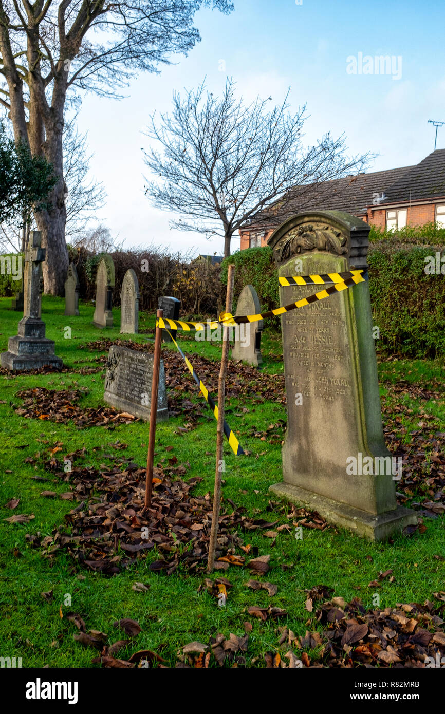 Protected headstone  in danger of falling over Stock Photo