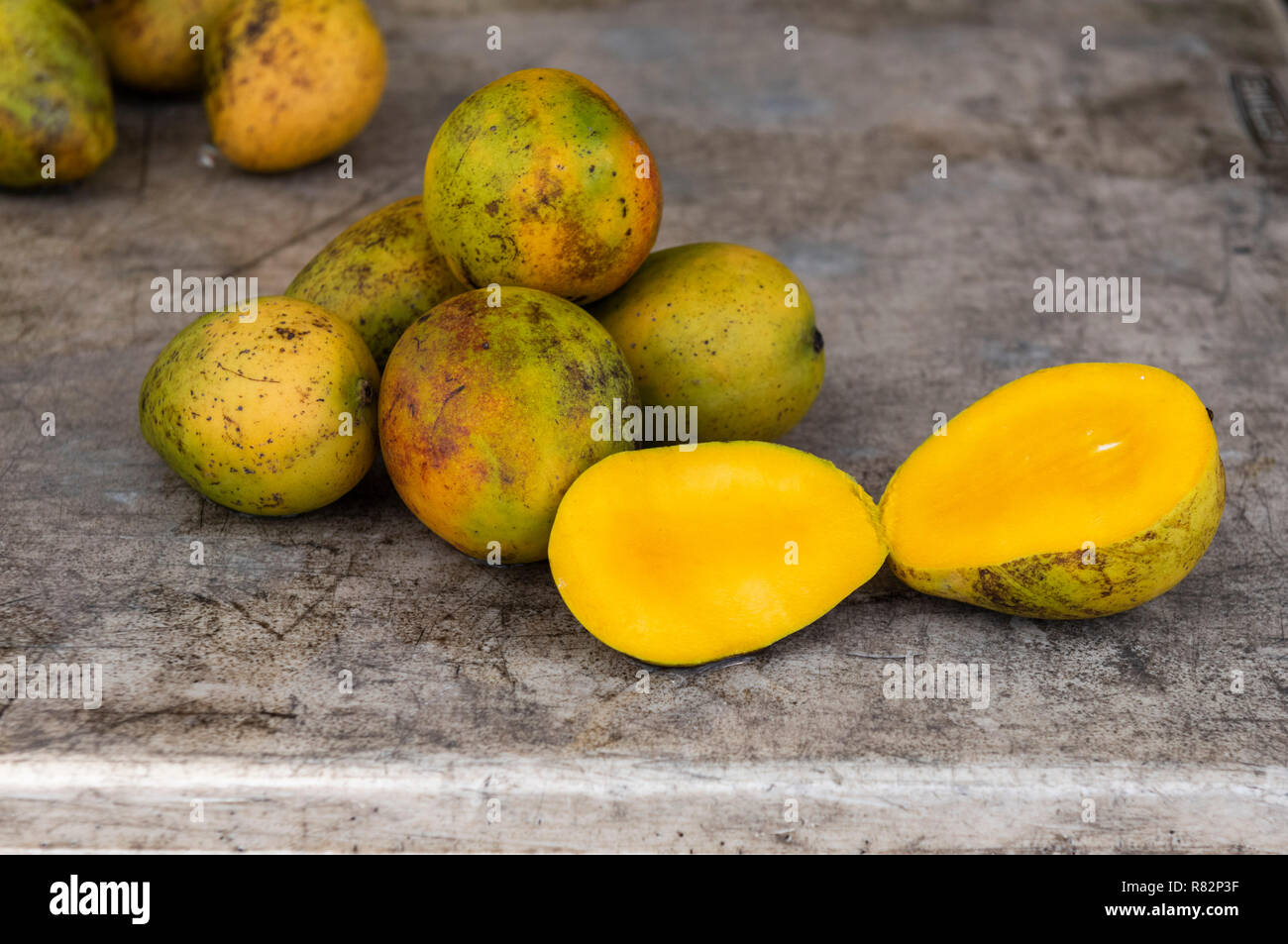 Mango cut in half Stock Photo Alamy