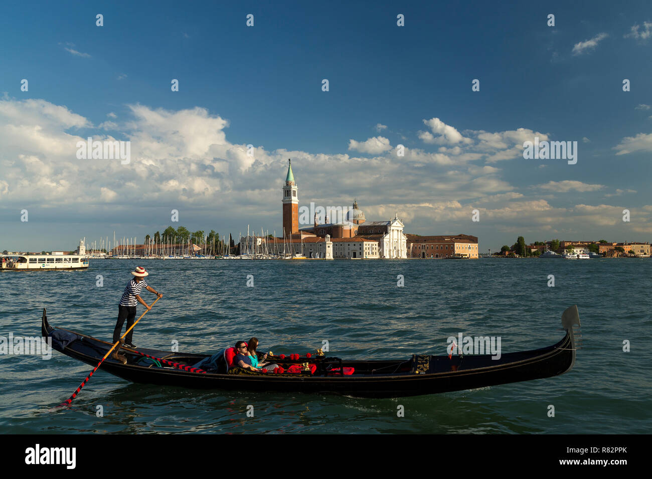 Gondola crossing the Lido di Venezia in front of Saint Mark's square in Venice, Italy. Stock Photo